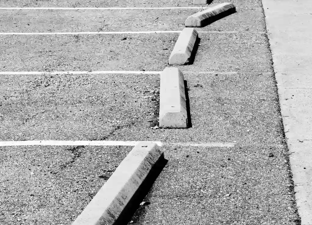 A view of inconsistent parking bay visuals used as a reference for what the EV charging layout and visuals were before the redesign