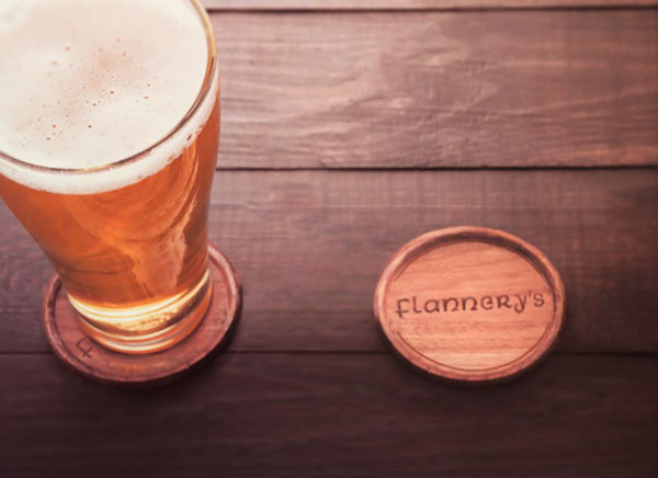 Flannery pyrography artwork detail on a coaster